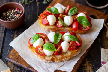Bruschetta with mozzarella, tomatoes and basil. Vegetarian food. Healthy eating.