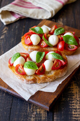 Bruschetta with mozzarella, tomatoes and basil. Vegetarian food. Healthy eating.