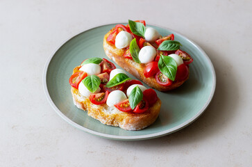 Bruschetta with mozzarella, tomatoes and basil. Vegetarian food. Healthy eating.
