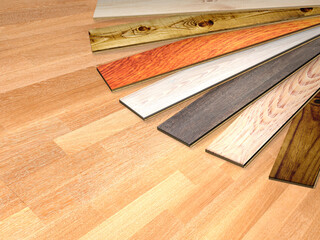 New parquet planks of different colors with different wood species on wooden floor