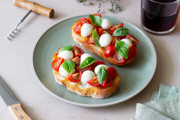 Bruschetta with mozzarella, tomatoes and basil. Vegetarian food. Healthy eating.