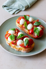Bruschetta with mozzarella, tomatoes and basil. Vegetarian food. Healthy eating.