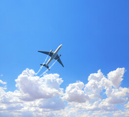 Vertical nature background with aircraft and Jet trailing smoke in the sky. Airplane and condensation trail