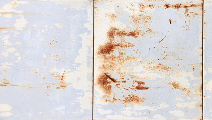Scratched surface of panels with paint and rust stains. Metal material with streaks of rust