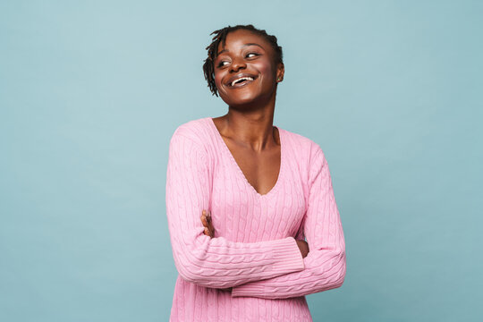 African american happy woman smiling and standing with arms folded