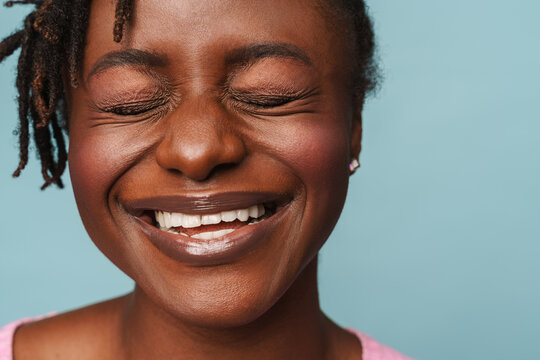 African american happy woman laughing with eyes closed