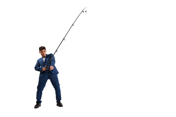 Portrait of young man, employee in official suit with fishing rod isolated over white studio...
