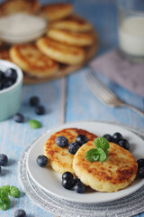 Cottage cheese pancakes - traditional Russian syrniki	