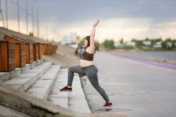 Overweight kid teen training and exercise at park town on stairs, concept sport exercise and...