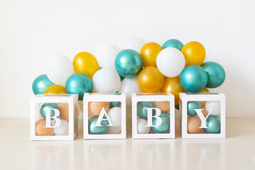Colorful balloons and the inscription BABY. birthday. Photo session in the studio. Birthday ideas for kids. Photo zone