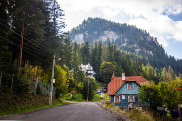 gloomy road in mountains and small town