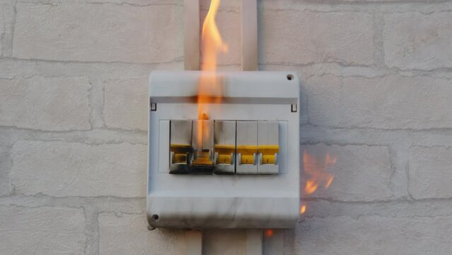Circuit breaker fire in switch box indoors. Fault contact switching device, malfunction electrical wiring, short circuit, overload.