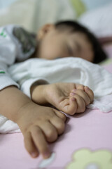 Close-up portrait image of​ 1-2 years old​ hand during baby sleeping