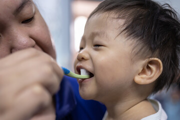Portrait image of​ 1-2 years old​ child happy brush teeth