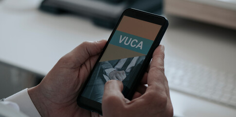 text VUCA in his smartphone, web banner