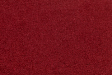 Texture of dark red and wine colors paper background, macro. Structure of dense maroon craft...