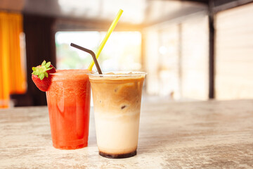 Summer refreshing drink, fruit strawberry frappe, smoothie, juice, ice and sparkling water. Ice latte coffee
