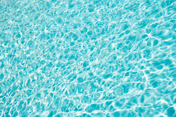 Obraz premium summer blue swimming pool rippled water background