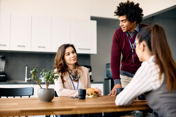 Happy businesswoman in wheelchair enjoys in lunch break with her colleagues in the office.