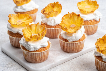 Cupcakes with dried pineapple flowers