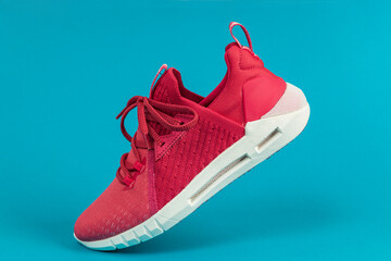 Running sports shoe on ???? background. Running shoe, sneaker or trainer. Women's athletic shoe. fitness, sport, training concept.