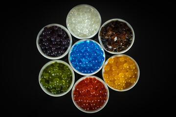 Different tapioca pearls for bubble tea. Bubble tea ingredients arrangement in bowls