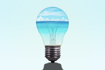 Close up of light bulb with turquoise water in sea