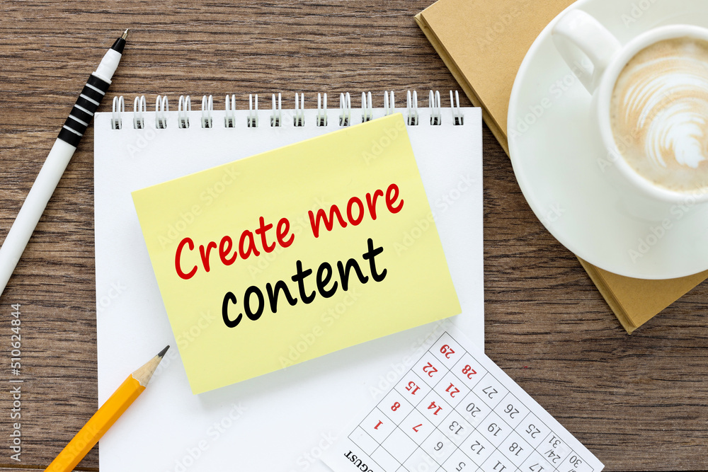 Poster create more content. written on a sticker on the table