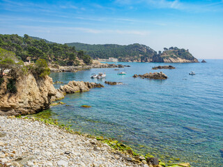 View of secluded cove with emerald green water near Palamos, Catalonia