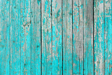 Fototapeta na wymiar Vintage wall made of old wooden boards with peeling paint.