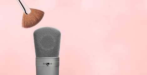 ASMR. fan shaped brush and microphone on pink background with copy space. Autonomous Sensory Meridian Response banner. - obrazy, fototapety, plakaty