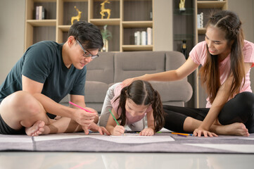 Family holiday activities where parents and children play together happily in the living room of the house.