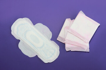 feminine hygienic white pads for menstruation on a purple background very peri