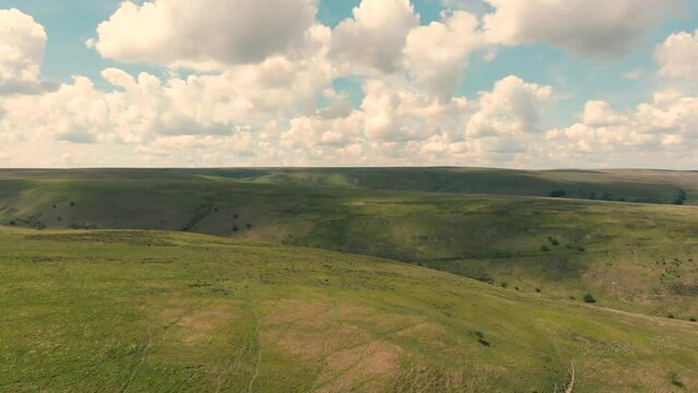 Aerial drone shot of lush green countryside and moorland in Exmoor National Park, UK