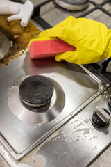 dirty kitchen stove, empty and full bottles of detergents around.