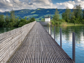 The historical wooden bridge (holzbrücke) and the 16th century bridge chapel (Helig Hüsli), Rapperswil, St. Gallen Switzerland