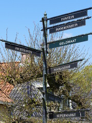 Signpost for tourists and locals in (Dutch) Sloten (Frisian) Sleat, Friesland, Netherlands