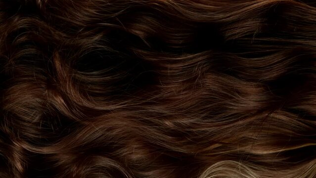 Super slow motion of wavy brown hair in detail. Filmed on high speed cinema camera, 1000 fps.