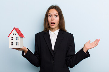 young adult woman amazed, shocked and astonished with an unbelievable surprise