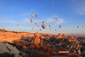 Mountain landscape with air balloons in Goreme, Cappadocia, Turkey