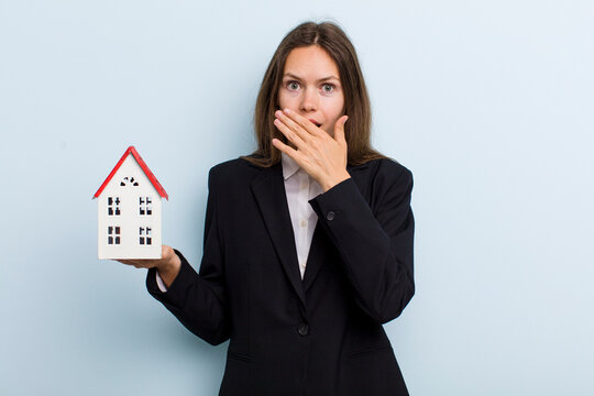 young adult woman covering mouth with hands with a shocked