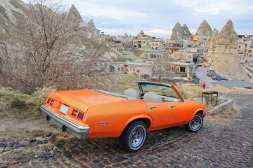 Cityscape with red car in Goreme, Cappadocia, Turkey