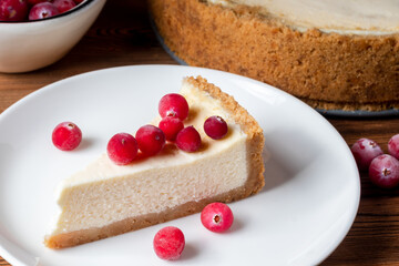 Cheesecake slice. Classical New York cheese cake on wooden background