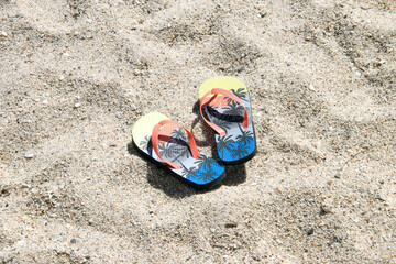 flip flops on the sand