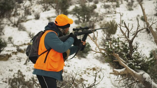 Guilt firing a rifle gun for deer hunting at US Colorado