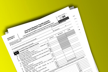 Form 990-T (Schedule A) documentation published IRS USA 12.22.2020. American tax document on colored