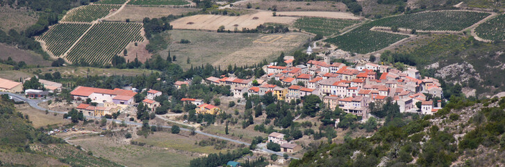 Fototapeta na wymiar Panoramic view of the old village of Cucugnan and the surrounding vineyards, Occitanie region in southern France
