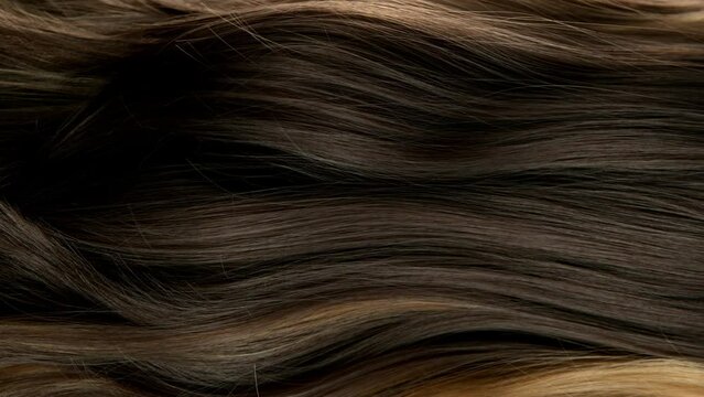 Super slow motion of wavy brown hair in detail. Filmed on high speed cinema camera, 1000 fps.