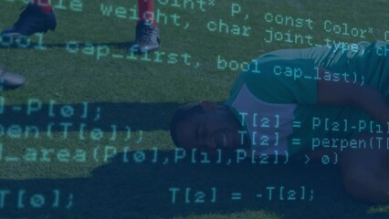 Data processing against injured african american male soccer player holding his leg on sports field - Powered by Adobe