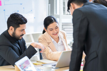 A group of young Asian businessmen Talking and planning work happily and have fun. at the company's office